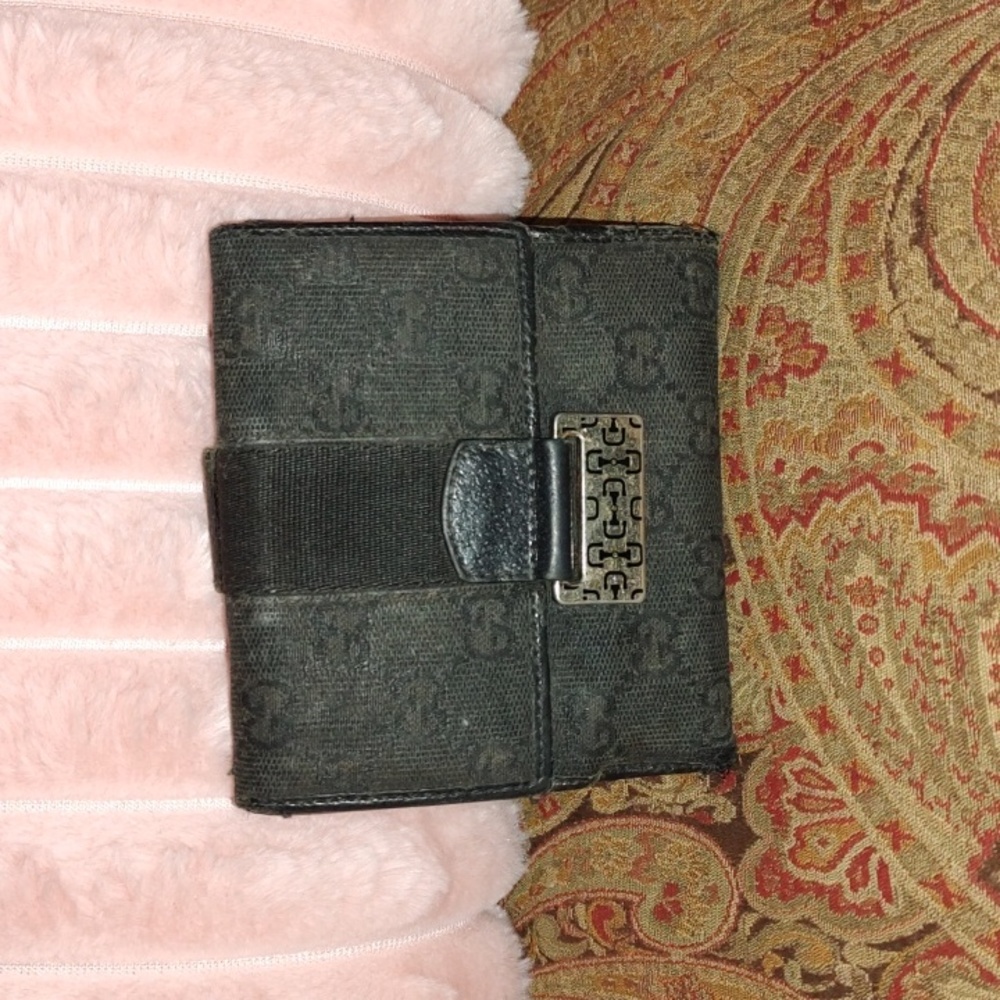 Gucci canvas and PVC black wallet. $220 retail. Good used condition.